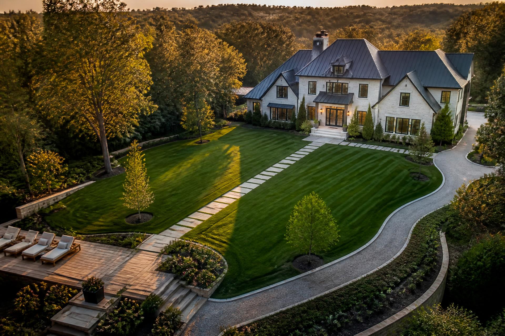 Luxury estate at golden hour with meticulously maintained landscaping